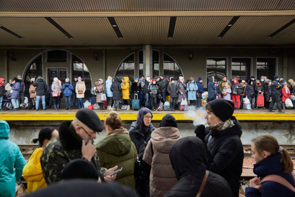 People wait to board an evacuation train to western regions on 1 March 2022 in Kyiv, Ukraine.