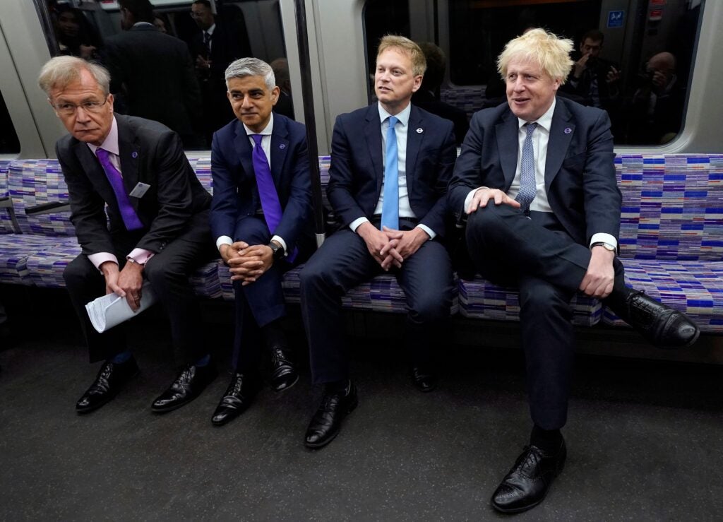 Politicians including the Prime Minister and the Mayor of London sit on an Elizabeth Line train at the opening ceremony.