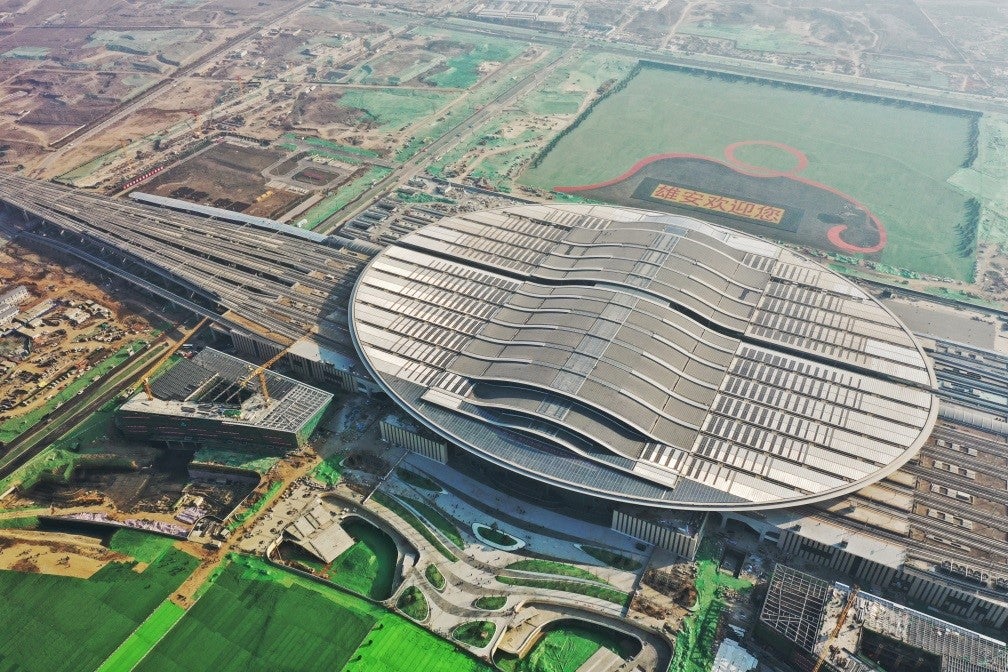 Aerial view of Beijing Daxing Airport and the connected high speed railways 