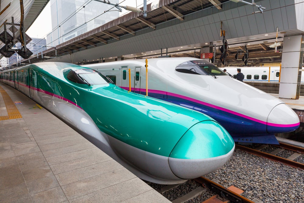Two Shinkansen bullet trains on the high-speed railway in tokyo, japan