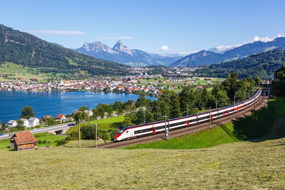A Stadluer Giruno high-speed train travelling through the swiss alps